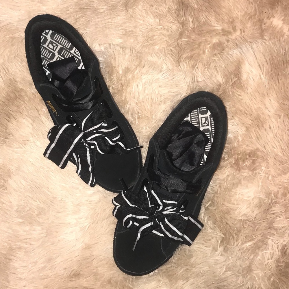Black Pumas with black and white fat laces